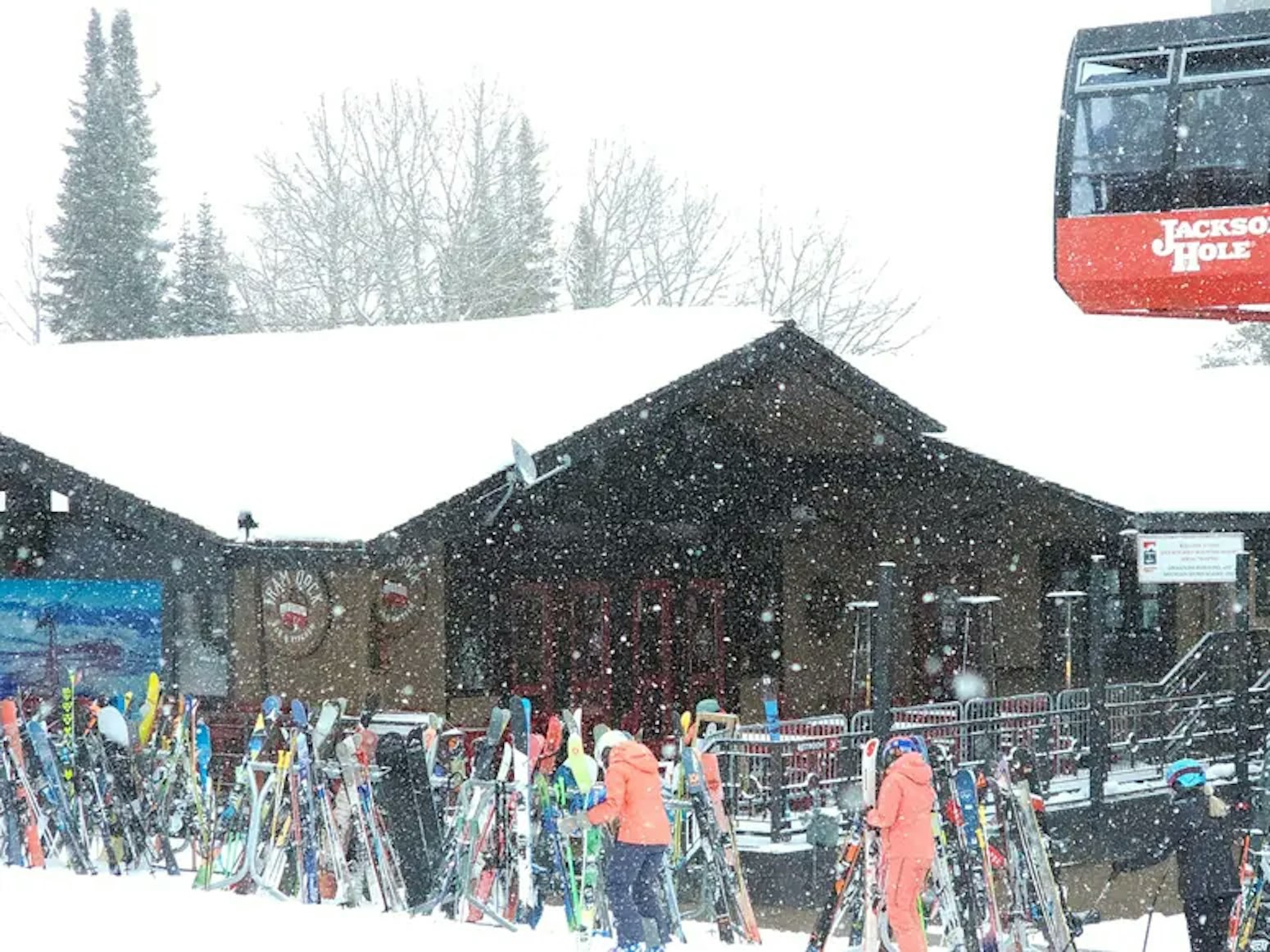 Tram dock bar with tram in front of it on snowy day